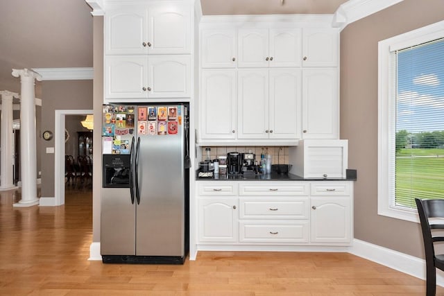 18707 Tillman Mill Rd, Athens, AL 35614 - kitchen featuring ornate columns, stainless steel refrigerator with ice dispenser, dark countertops, and white cabinets