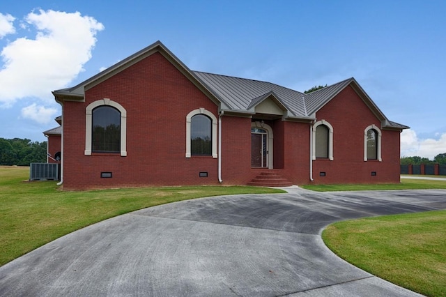 18707 Tillman Mill Rd, Athens, AL 35614 - view of front facade with metal roof, brick siding, crawl space, a standing seam roof, and a front yard
