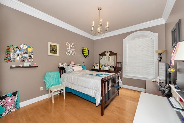 18707 Tillman Mill Rd, Athens, AL 35614 - bedroom featuring a notable chandelier, crown molding, baseboards, and wood finished floors