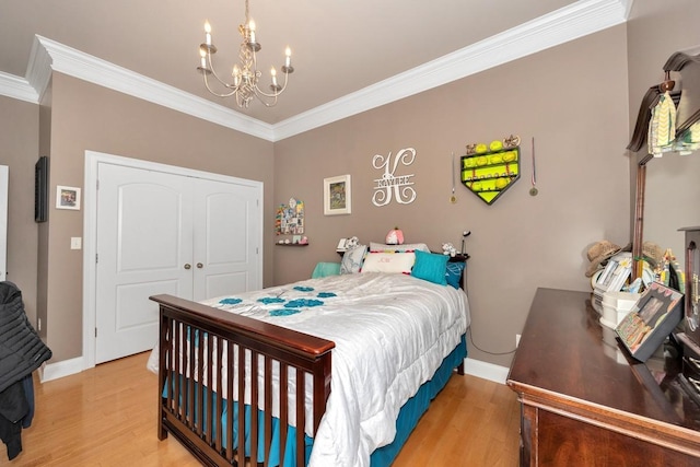 18707 Tillman Mill Rd, Athens, AL 35614 - bedroom featuring light wood-style floors, a closet, a chandelier, and crown molding
