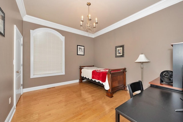 18707 Tillman Mill Rd, Athens, AL 35614 - bedroom featuring ornamental molding, a chandelier, light wood-style flooring, and baseboards