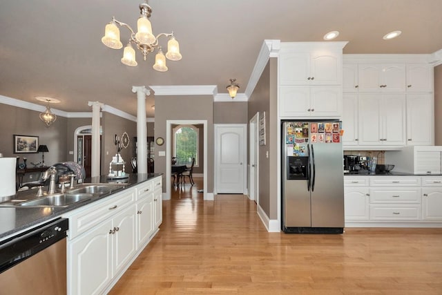 18707 Tillman Mill Rd, Athens, AL 35614 - kitchen with crown molding, a sink, appliances with stainless steel finishes, dark countertops, and ornate columns