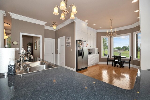 18707 Tillman Mill Rd, Athens, AL 35614 - kitchen with a sink, dark countertops, a notable chandelier, and stainless steel fridge with ice dispenser