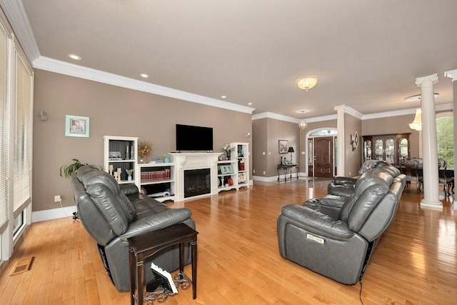 18707 Tillman Mill Rd, Athens, AL 35614 - living area with baseboards, light wood-style floors, crown molding, ornate columns, and a fireplace