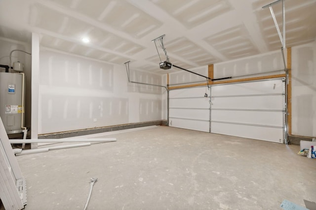 garage with water heater and a garage door opener