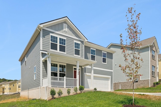 view of front of property with board and batten siding, a front lawn, a porch, and a garage