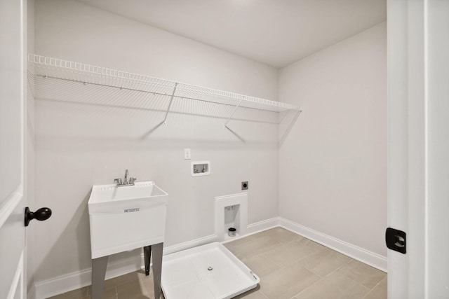 laundry room featuring laundry area, hookup for a washing machine, electric dryer hookup, and baseboards