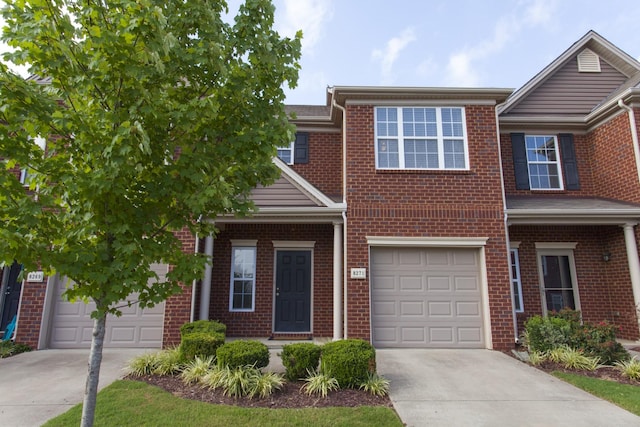 view of property with concrete driveway, brick siding, and an attached garage