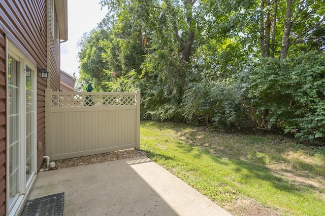 view of yard with a patio and fence