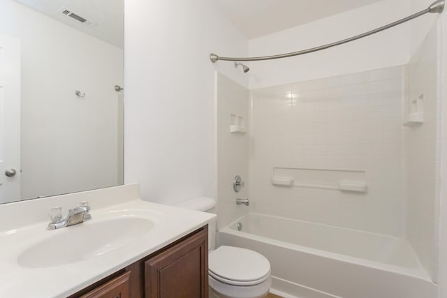 bathroom featuring toilet, visible vents, tub / shower combination, and vanity