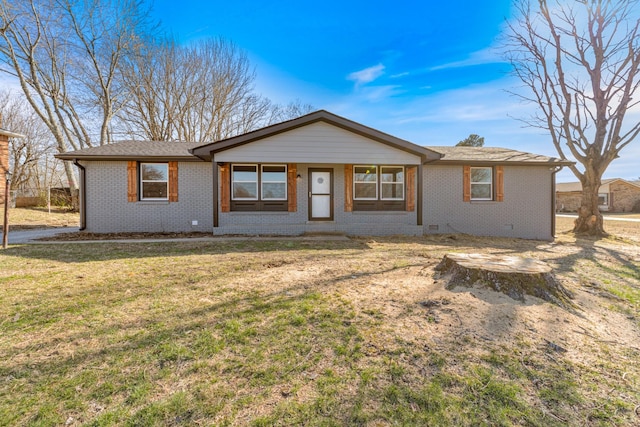 ranch-style home with brick siding and a front lawn