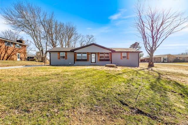 view of front of home featuring brick siding and a front yard