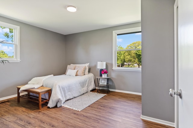 100 Eleazer Dr, Dickson, TN 37055 - bedroom with baseboards, multiple windows, and wood finished floors