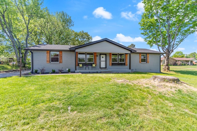 100 Eleazer Dr, Dickson, TN 37055 - ranch-style house with a front lawn and brick siding
