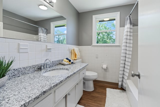 100 Eleazer Dr, Dickson, TN 37055 - full bathroom featuring vanity, toilet, shower / bath combination with curtain, tile walls, and wood finished floors