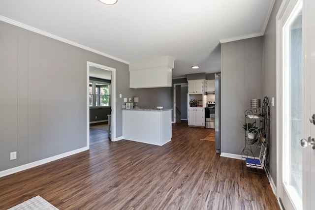 100 Eleazer Dr, Dickson, TN 37055 - kitchen featuring ornamental molding, dark wood-style flooring, white cabinetry, and stainless steel range with electric stovetop