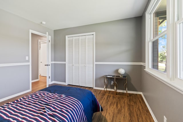 100 Eleazer Dr, Dickson, TN 37055 - bedroom featuring baseboards, multiple windows, and wood finished floors