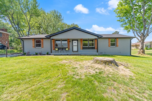 100 Eleazer Dr, Dickson, TN 37055 - view of front facade with a porch, brick siding, and a front lawn