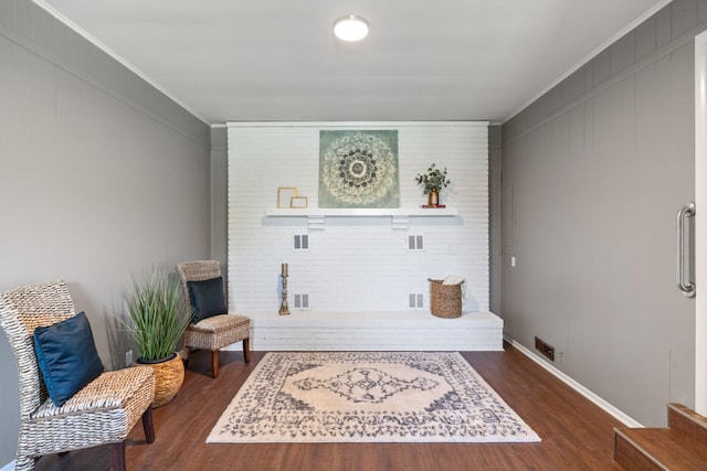 100 Eleazer Dr, Dickson, TN 37055 - living area featuring baseboards, dark wood finished floors, ornamental molding, and visible vents