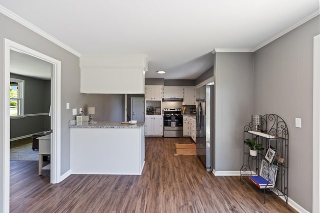 100 Eleazer Dr, Dickson, TN 37055 - kitchen with dark wood-style flooring, a peninsula, appliances with stainless steel finishes, and white cabinetry