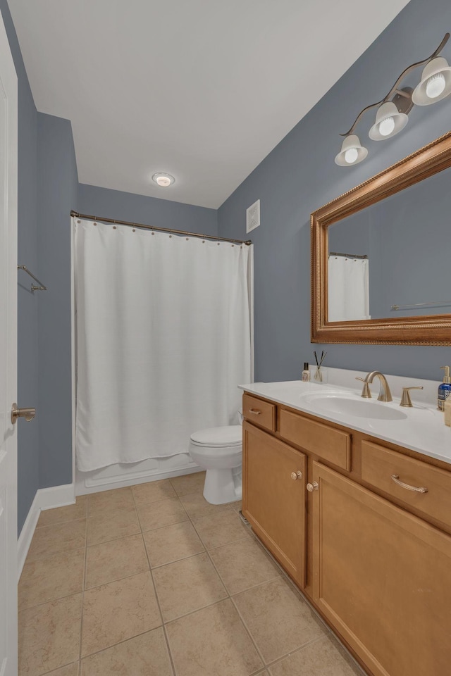 full bathroom with a shower with shower curtain, vanity, toilet, and tile patterned floors