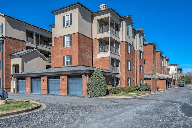 view of building exterior with driveway