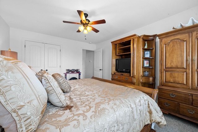 bedroom with a closet, carpet flooring, and a ceiling fan