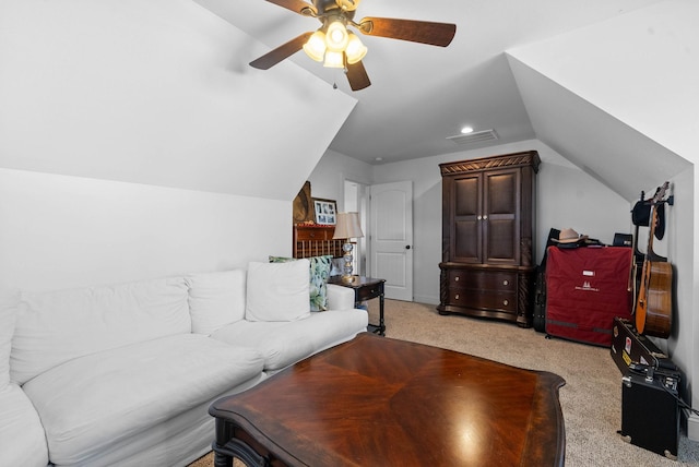 living area featuring lofted ceiling, light carpet, visible vents, and a ceiling fan