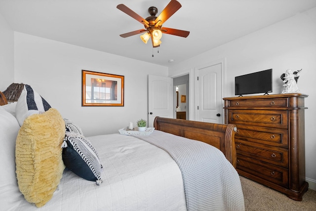 bedroom with ceiling fan and carpet flooring