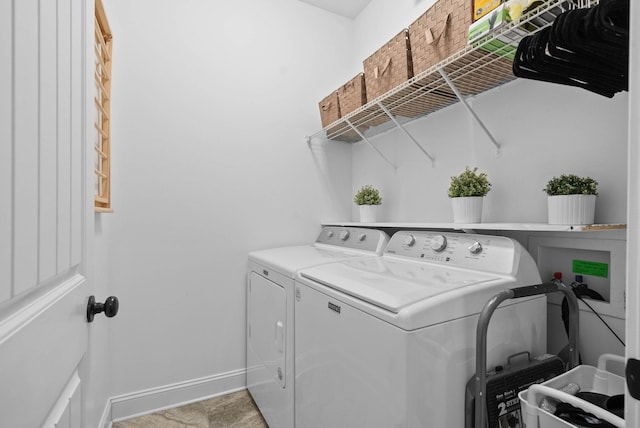 clothes washing area with laundry area, independent washer and dryer, and baseboards