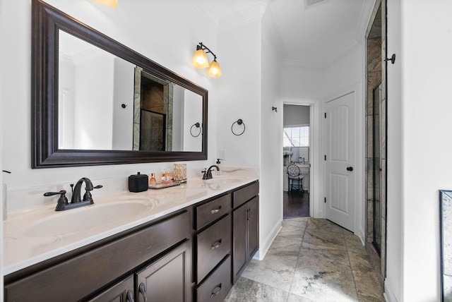 bathroom with double vanity, crown molding, and a sink