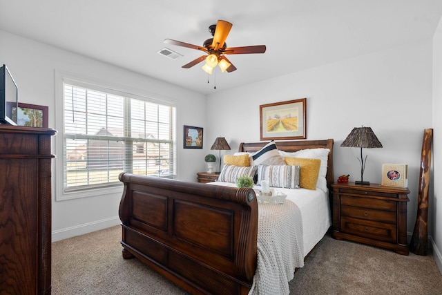 carpeted bedroom featuring visible vents, ceiling fan, and baseboards