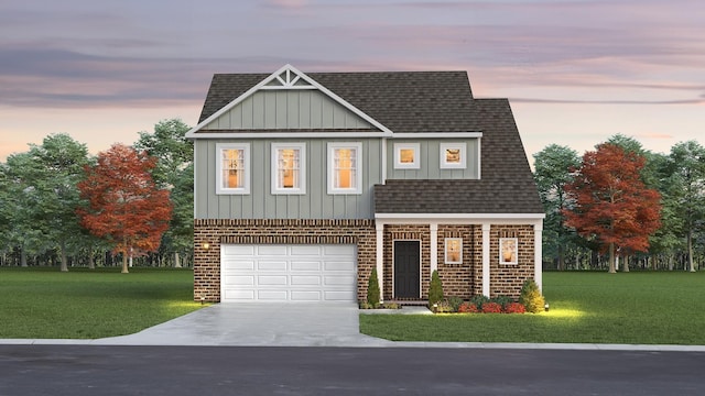 view of front of house with driveway, a garage, roof with shingles, a front yard, and brick siding