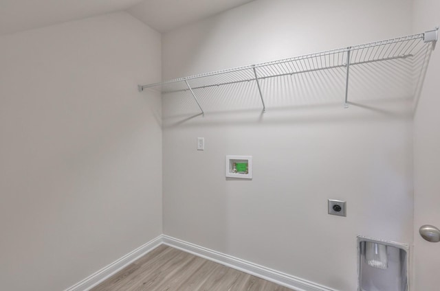 laundry area featuring laundry area, light wood finished floors, baseboards, washer hookup, and electric dryer hookup