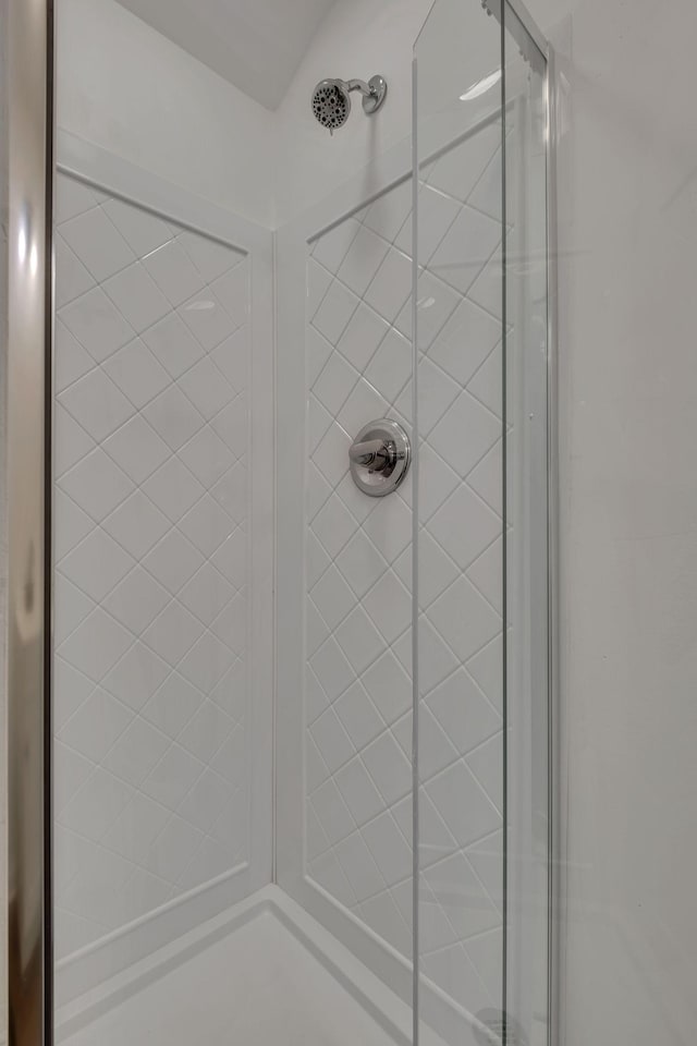 full bathroom featuring a shower stall