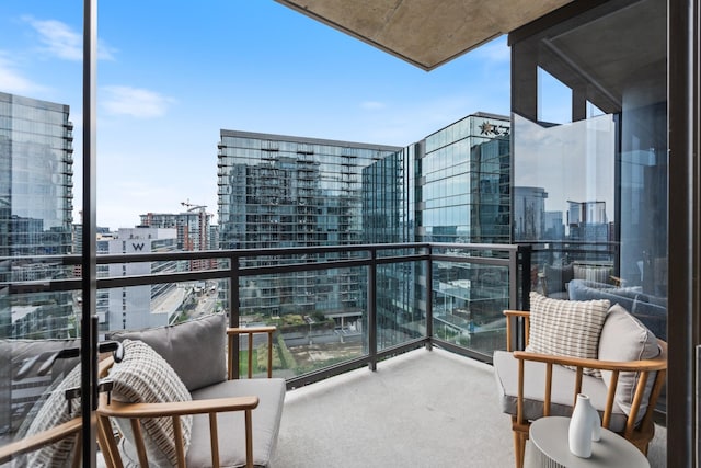 balcony featuring a city view