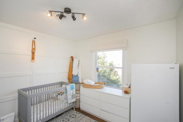 bedroom with a nursery area