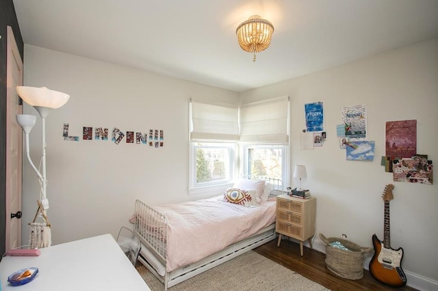 bedroom featuring wood finished floors