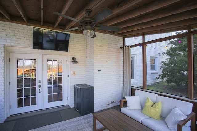 deck featuring ceiling fan, an outdoor living space, and french doors