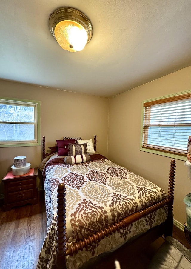 bedroom with wood-type flooring