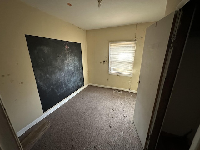 unfurnished bedroom with visible vents and baseboards