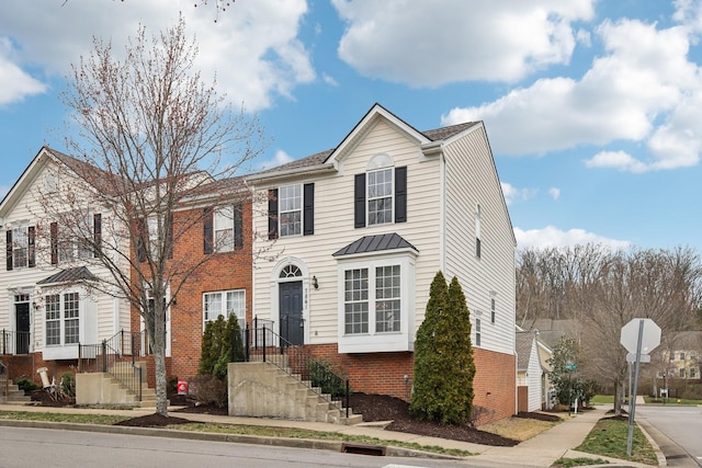 view of front facade featuring brick siding