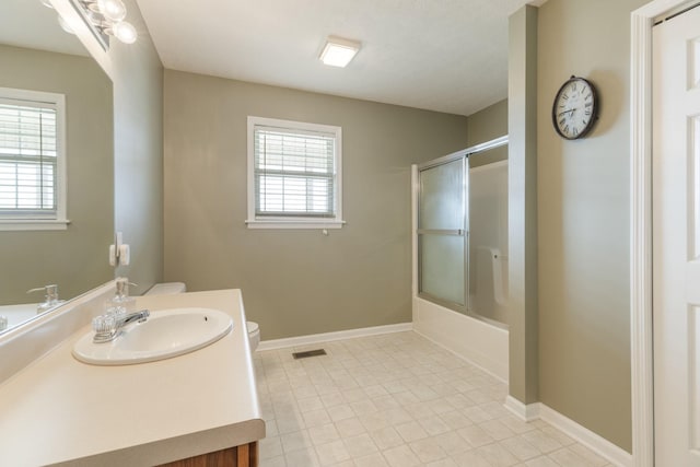 full bathroom with baseboards, visible vents, vanity, and toilet