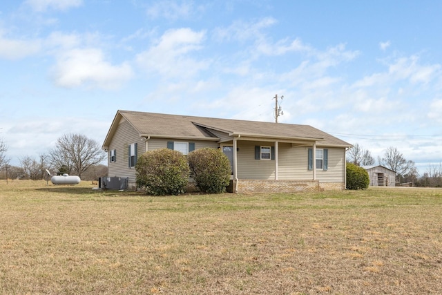 ranch-style home with central AC and a front lawn