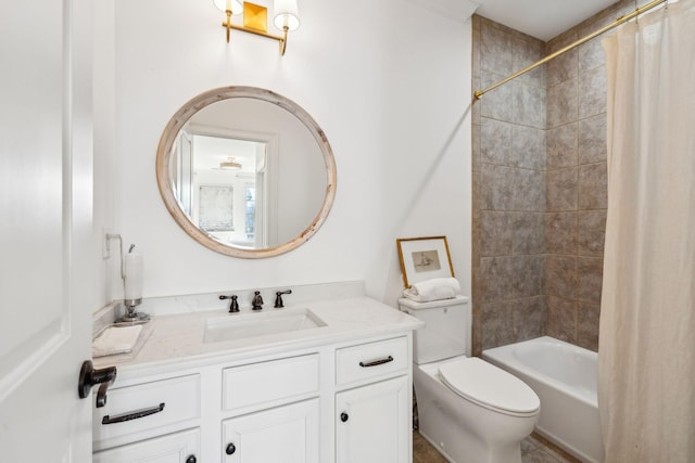 bathroom featuring toilet, shower / bath combo with shower curtain, and vanity