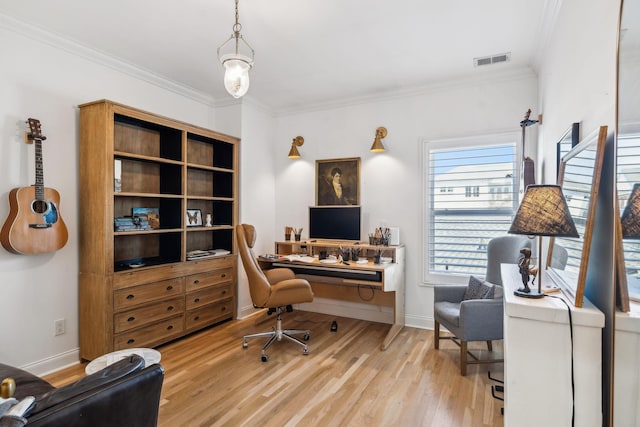 office area with baseboards, wood finished floors, visible vents, and crown molding