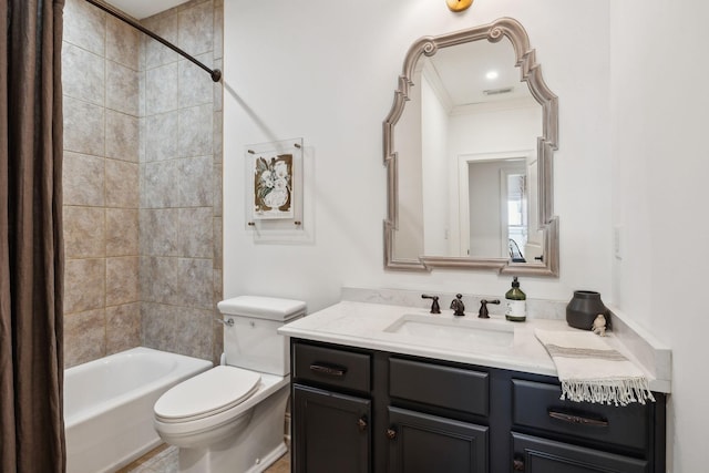 bathroom with visible vents, toilet, crown molding, vanity, and shower / bathing tub combination