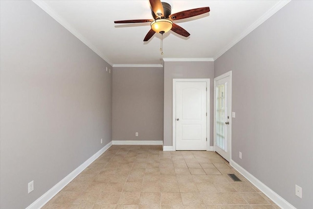 spare room with a ceiling fan, visible vents, crown molding, and baseboards