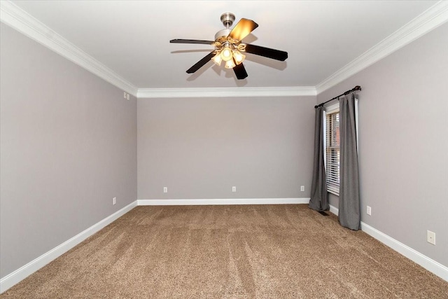 unfurnished room with ornamental molding, carpet flooring, a ceiling fan, and baseboards