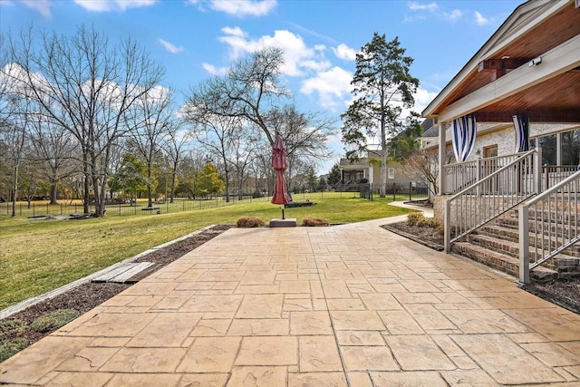 view of patio featuring fence